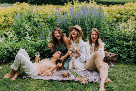 beautiful-women-enjoying-on-grass-field