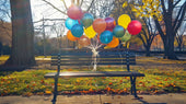 colorful-balloons-in-a-bench